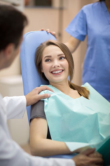 Dentist explaining post-operative care to patient