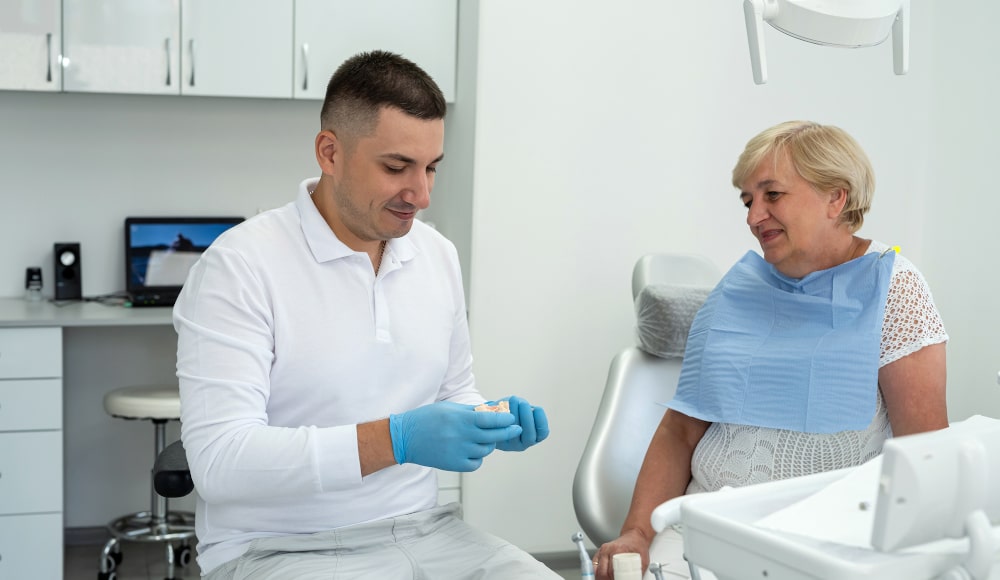Dentist explaining post-surgery care for dental implants
