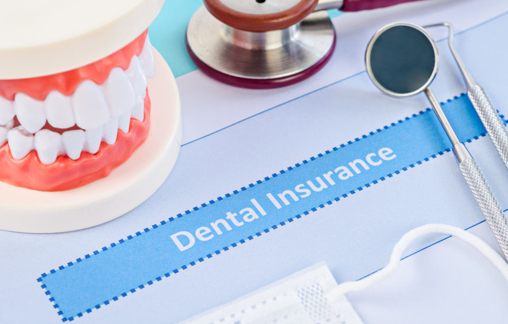 Dental tools and insurance documents illustrating dental insurance plans, coverage limits, and annual maximums in Canada.